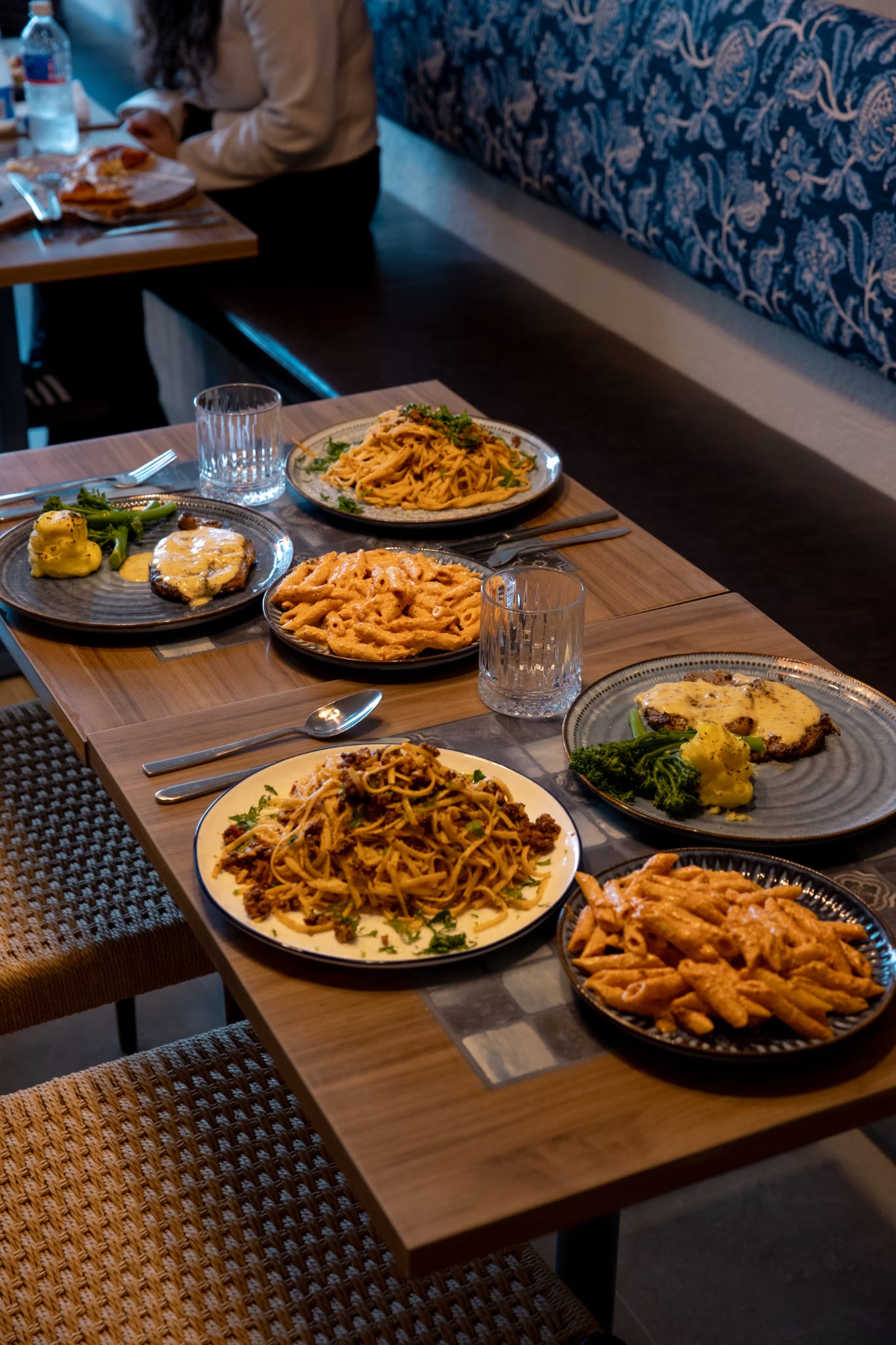 Table set with dishes in Babylon's warm dining room